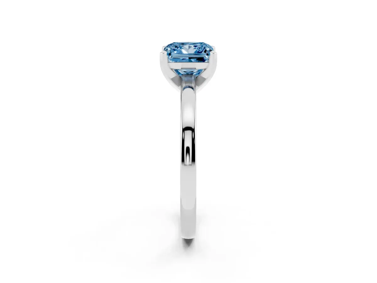 Fancy Blue Princess Cut Solitaire Diamond Engagement Ring with Four-Prong Setting on a Classic Band Silver
