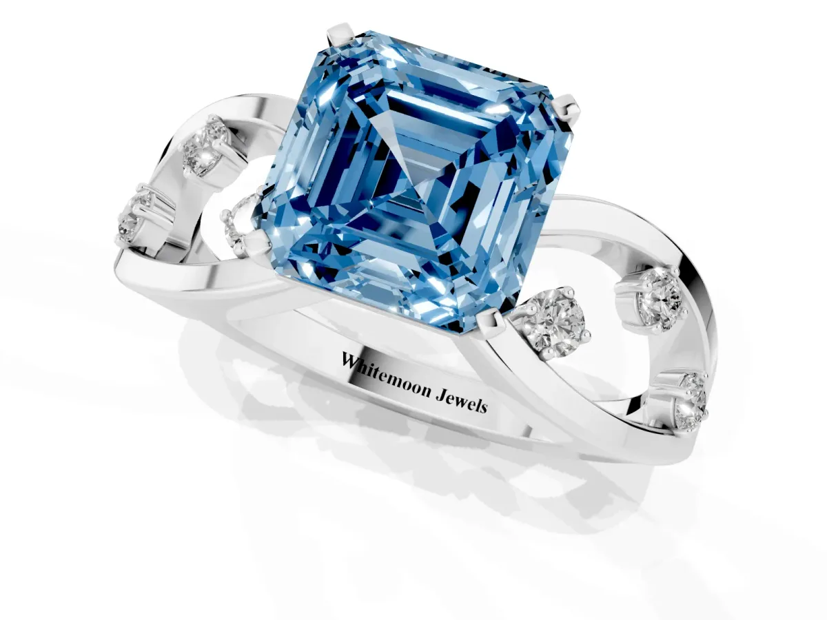 Fancy Blue Asscher Cut Cut Solitaire Diamond with Side Stones on Criss-Cross Band and Four-Prong Setting Platinum