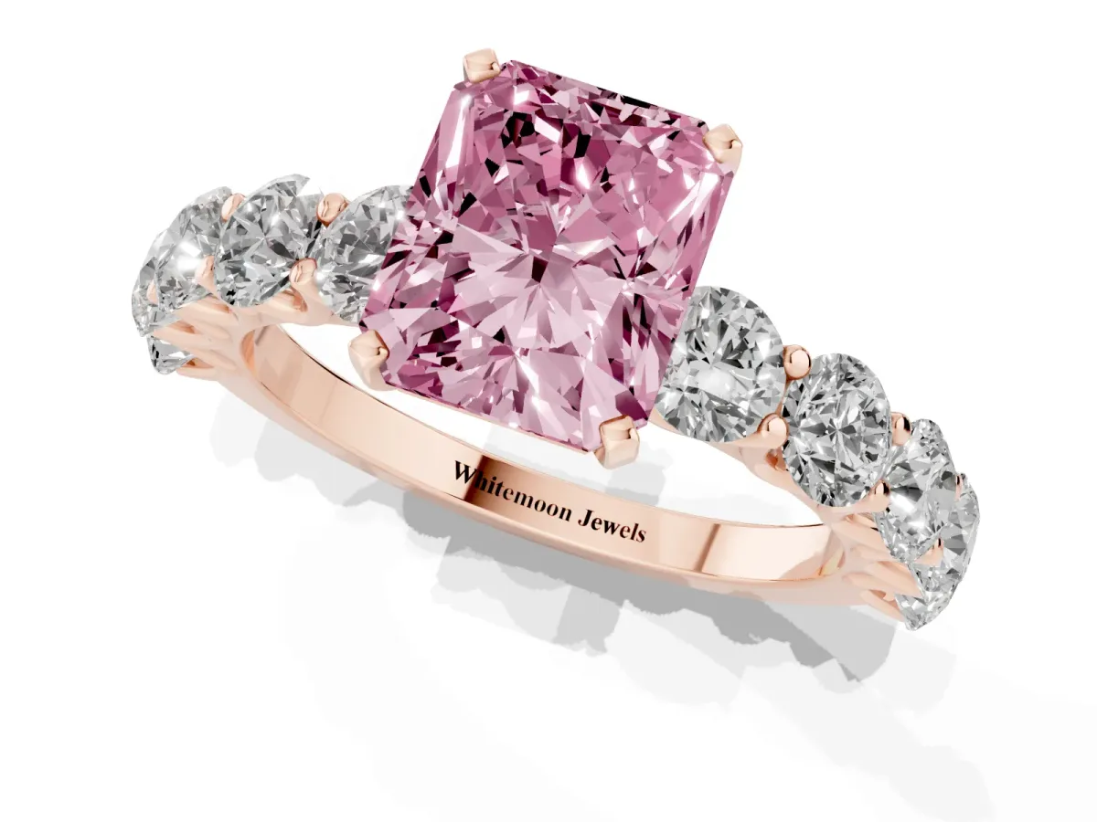 Fancy Pink Radiant Cut Diamond Prong Setting with Side Stones on a Pave Band Rose gold