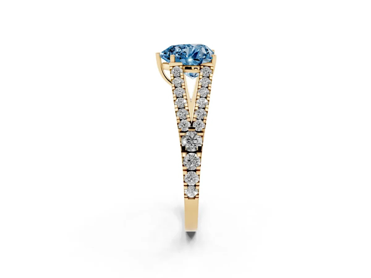 Fancy Blue Heart Cut Diamond Split Shank Engagement Ring with Round Pavé and Prong Setting Yellow gold