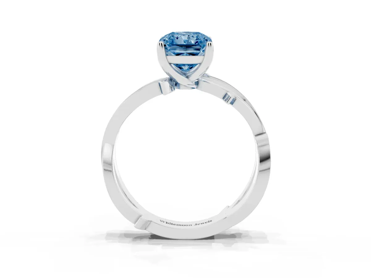 Fancy Blue Radiant Cut Solitaire Twist Band with Pavé Accents and Four-Prong Setting Silver