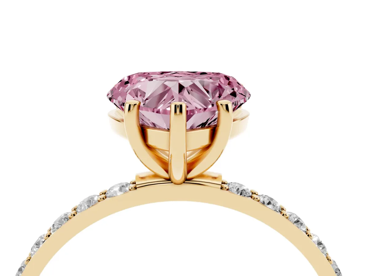 Fancy Pink Heart Cut Diamond Solitaire Ring with Round Pavé Shoulders and Prong Setting Yellow gold