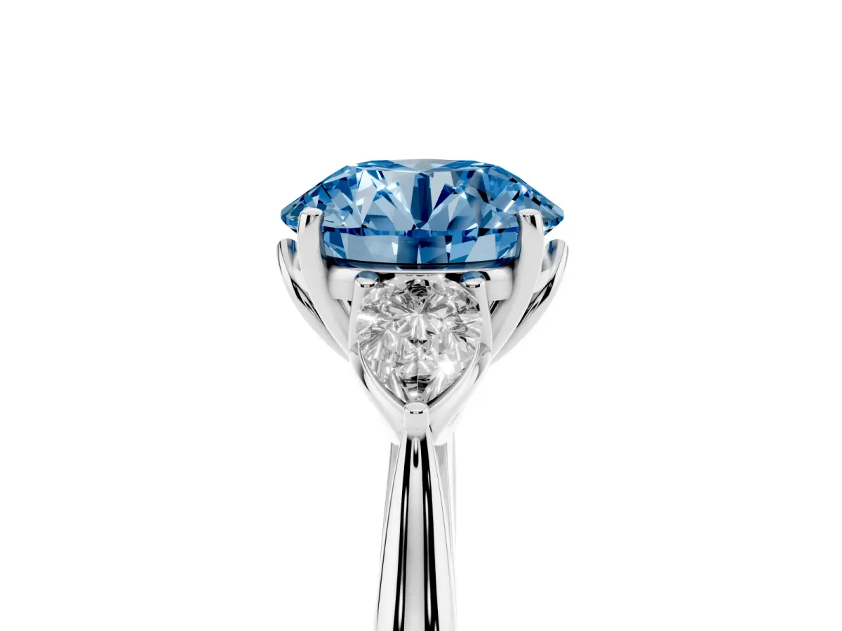 Fancy Blue Three-Stone Round Cut Diamond Ring with Pear Side Stones in Four-Prong Setting Silver