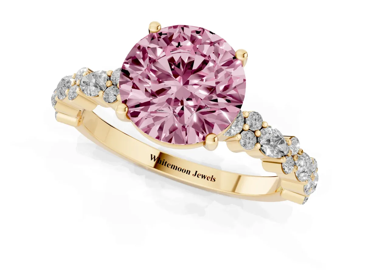 Fancy Pink Round Cut Diamond Side Stone Solitaire Ring with Round and Four-Prong Setting Yellow gold