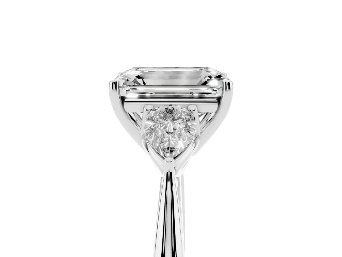 Three-Stone Emerald Cut Diamond Ring with Pear Side Stones in Four-Prong Setting Platinum