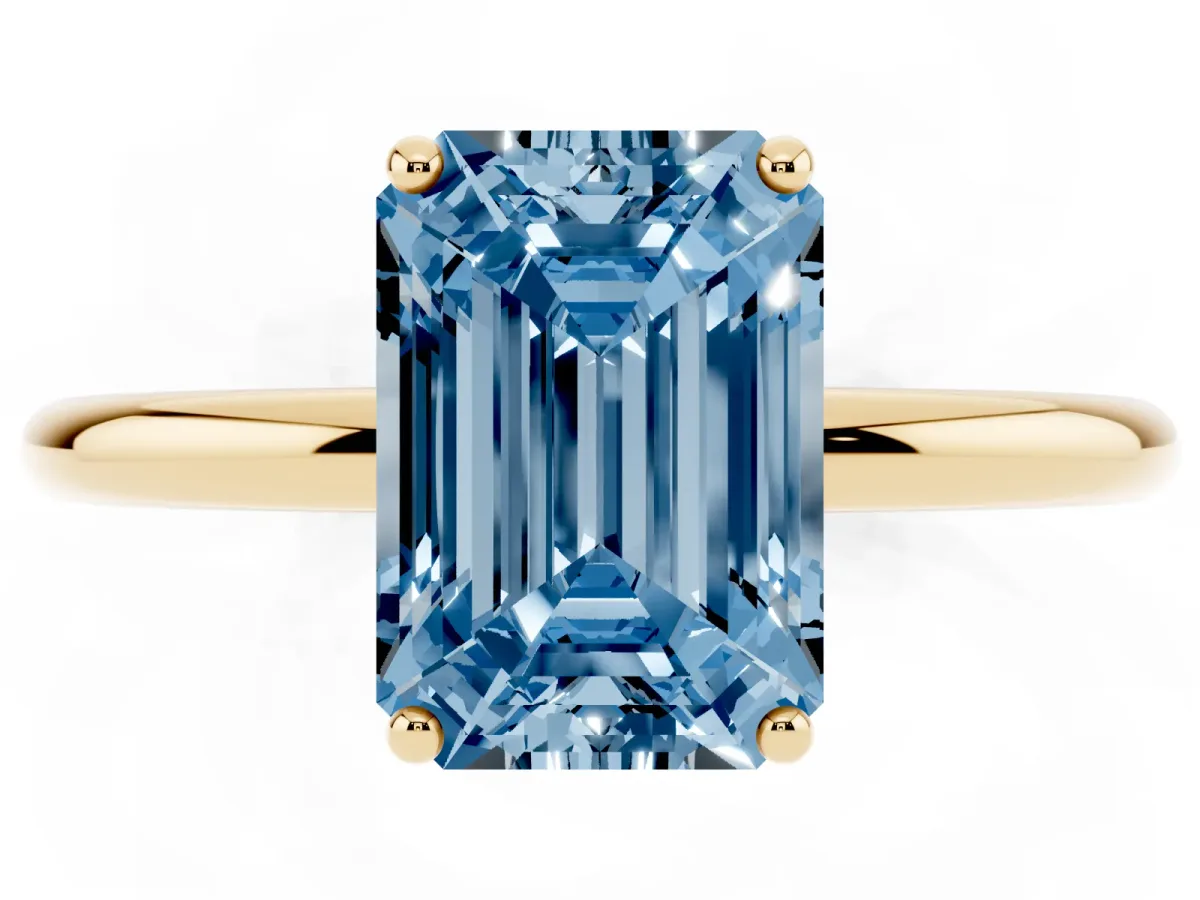 Fancy Blue Emerald Cut Solitaire Diamond Ring with a Classic Band and Four-Prong Setting Yellow gold