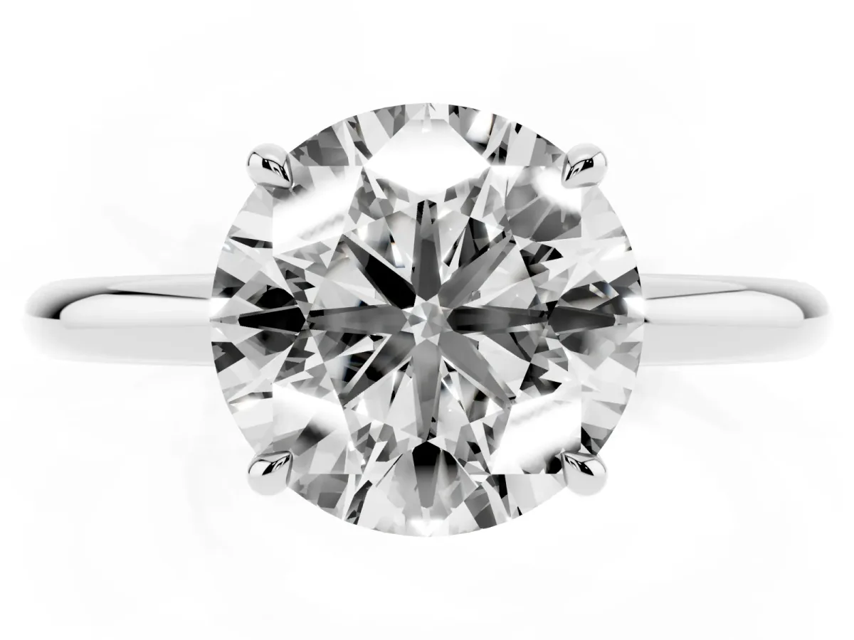 Round Cut Diamond Solitaire Ring with Thin Band and Four-Prong Setting Silver
