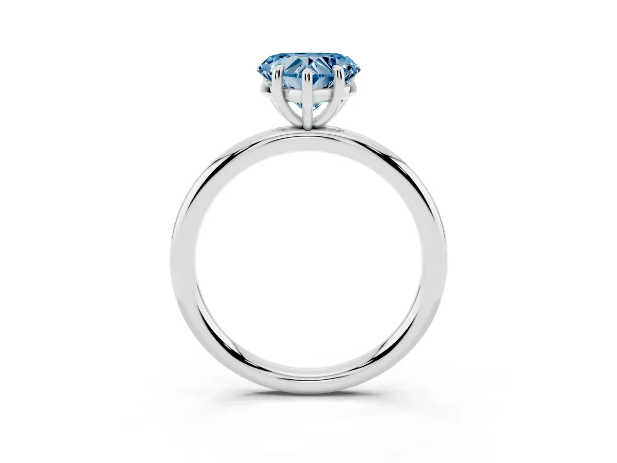 Fancy Blue Heart Cut Solitaire Diamond Ring with Four-Prong Setting on a Plain Band Platinum