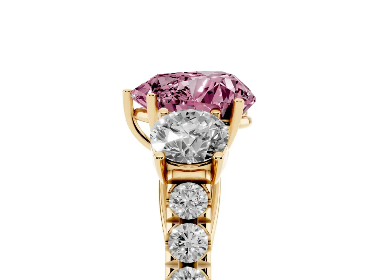 Fancy Pink Heart Cut Cut Diamond Three-Stone Ring with Round Side Stones and Pavé Band Yellow gold