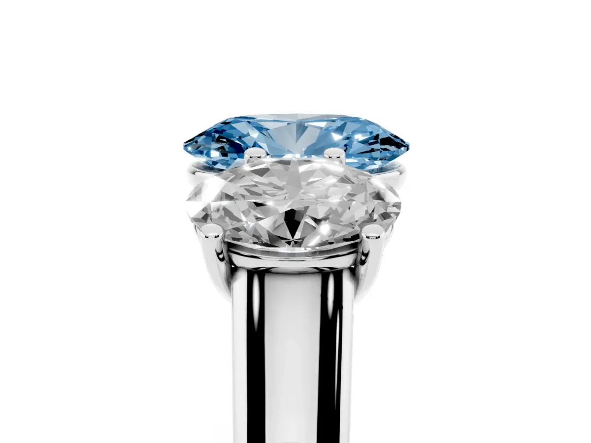 Fancy Blue Oval Cut Three-Stone Diamond Ring with Prong Setting on a Classic Band Platinum