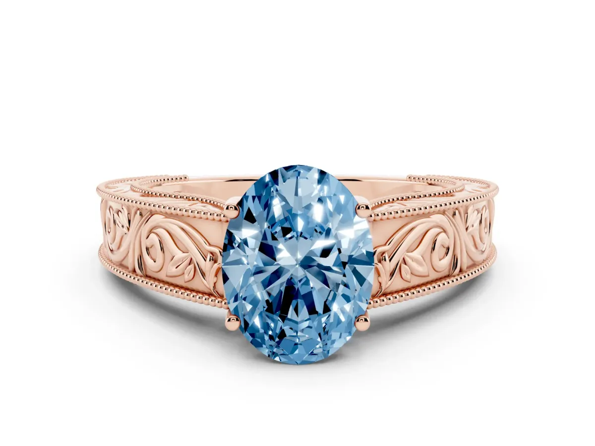 Fancy Blue Oval Cut Diamond Solitaire Ring with Engraved Band and Four-Prong Setting Rose gold