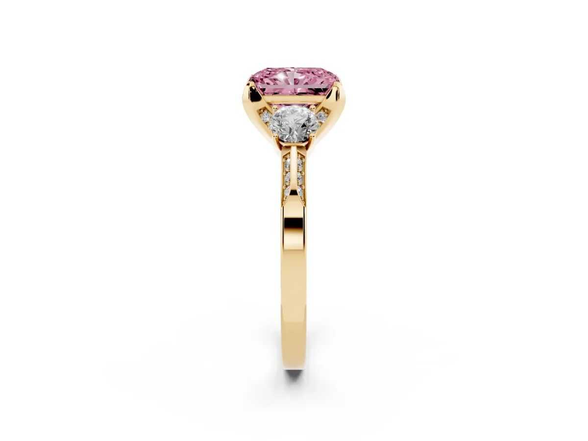 Fancy Pink Radiant Cut Brilliant Three-Stone Diamond Ring with Pavé Band and Four-Prong Setting Yellow gold