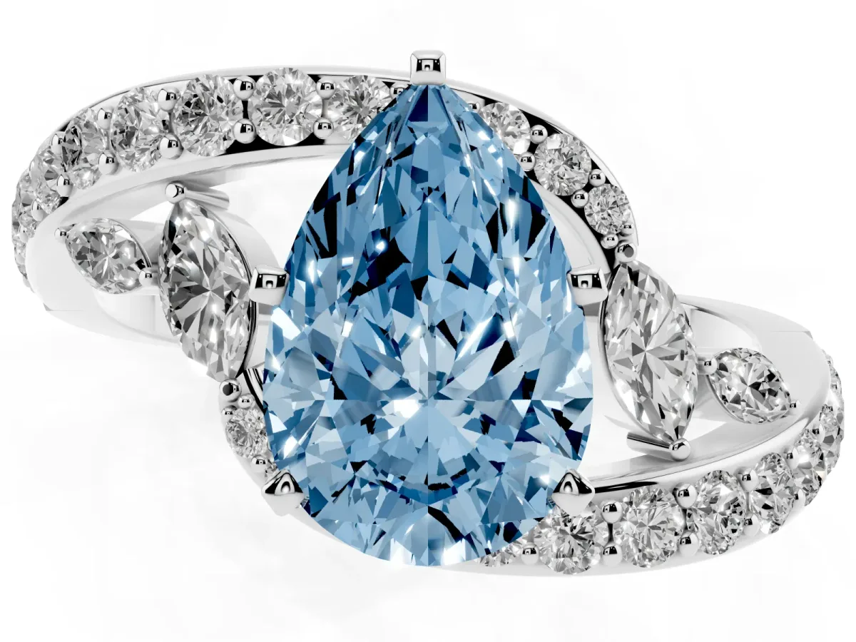 Fancy Blue Pear Cut Solitaire with Pavé Twist Band and Four-Prong Setting Silver