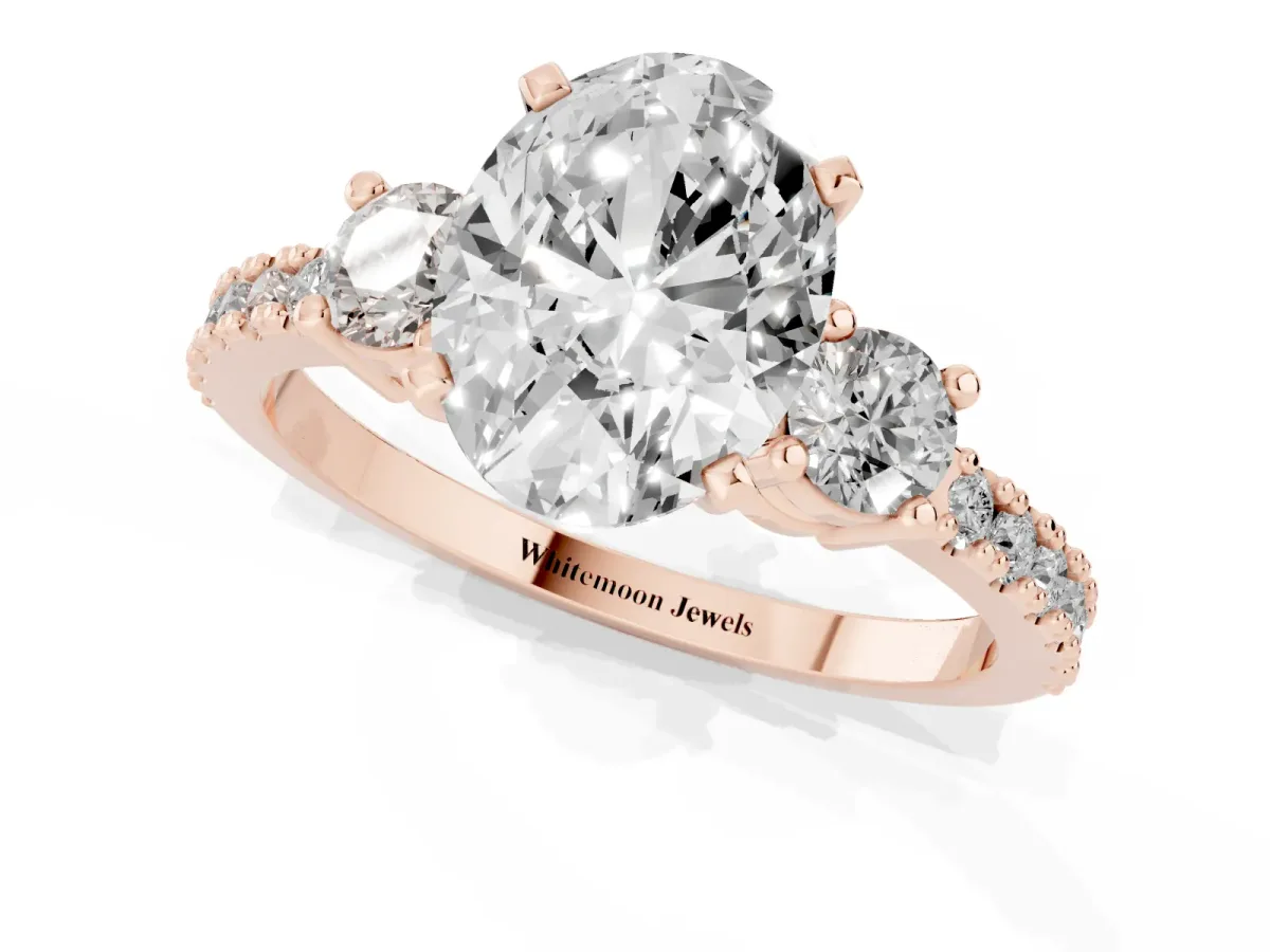 Oval Cut Three-Stone Diamond Pavé Band with Prong Setting Rose gold