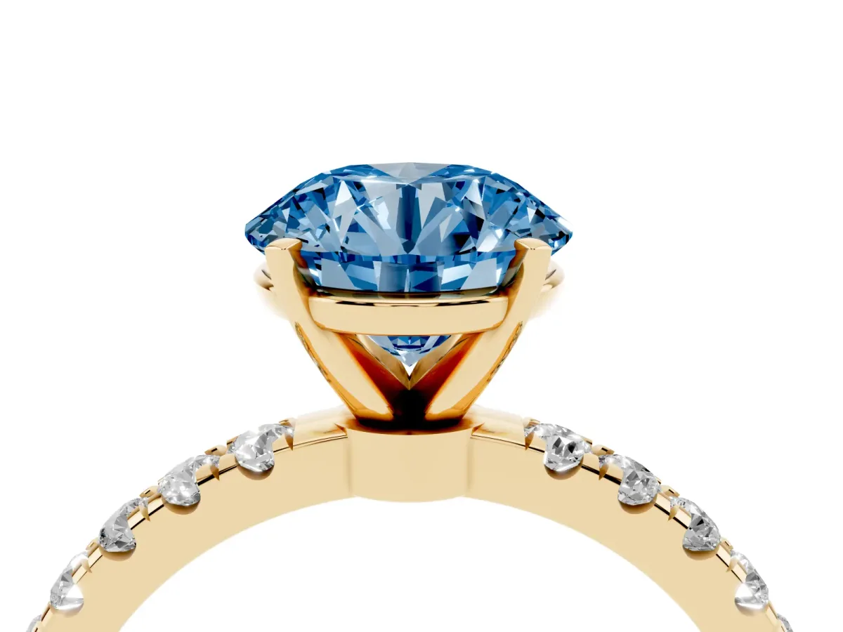 Fancy Blue Round Cut Diamond Solitaire Ring with Pavé Accents and Four-Prong Setting Yellow gold