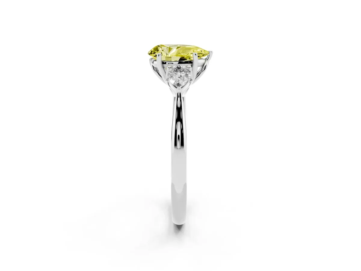 Fancy Yellow Three-Stone Pear Cut Brilliant Diamond Solitaire Ring with Tapered Band and Four-Prong Setting Platinum