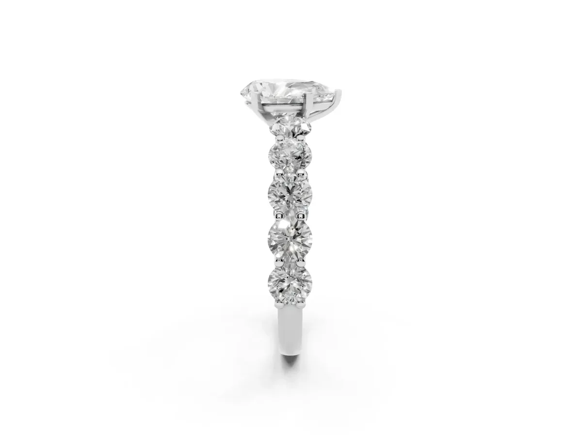 Pear Cut Diamond Prong Setting with Side Stones on a Pave Band Silver