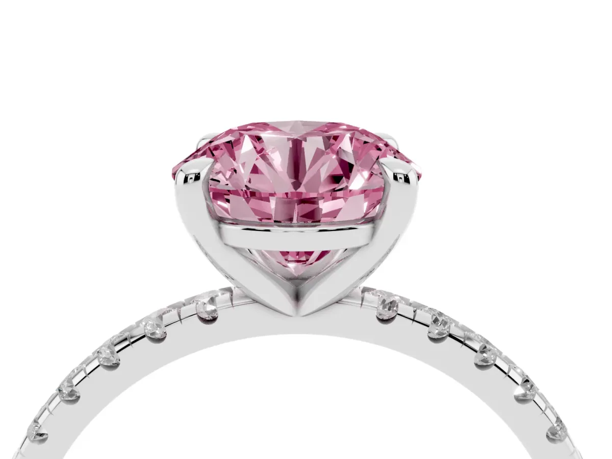 Fancy Pink Round Cut Diamond Brilliant Solitaire Ring with Pavé Band and Four-Prong Setting Silver
