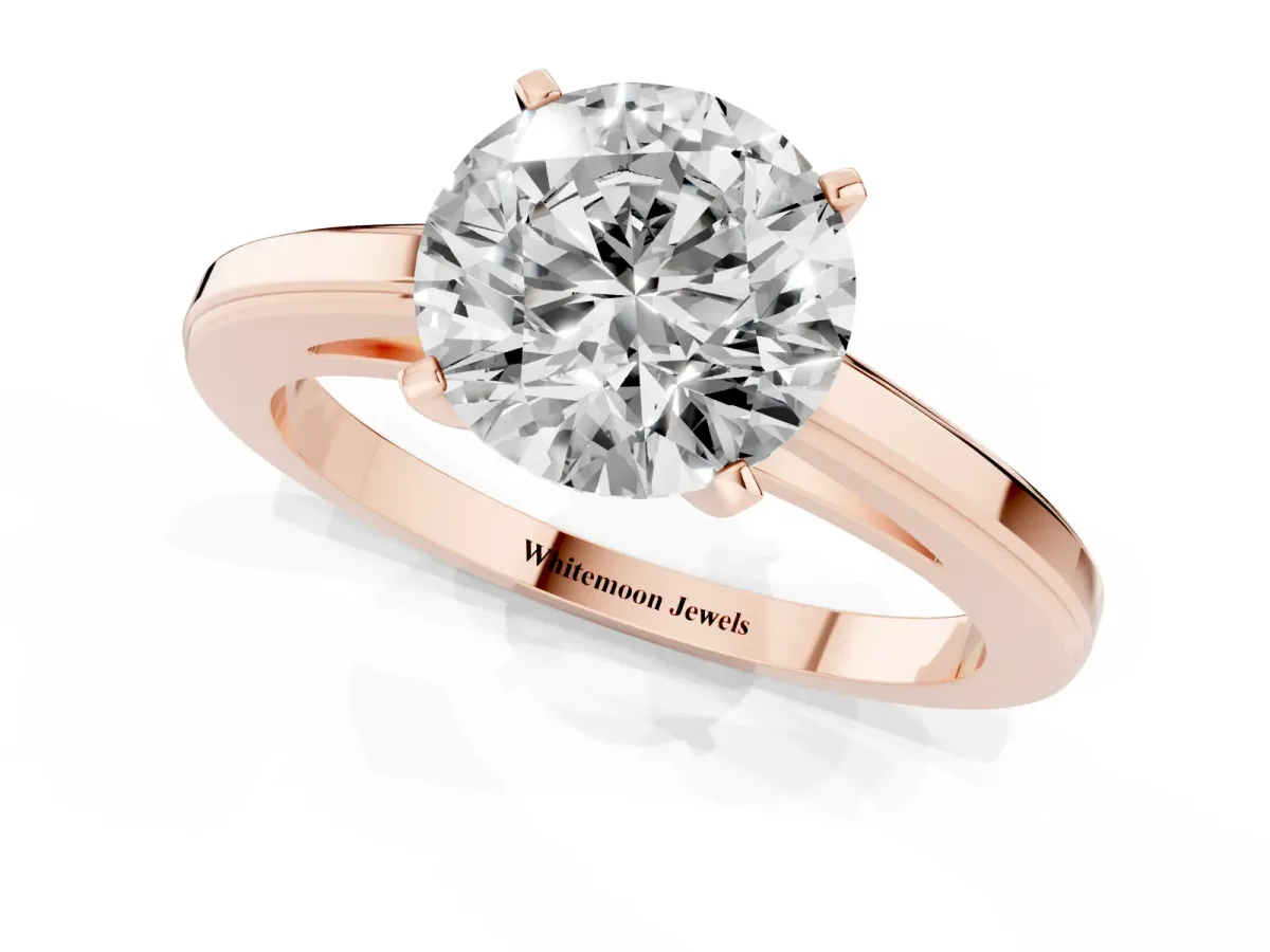 Round Cut Solitaire Diamond Ring with Four-Prong Setting and Classic Band Rose gold