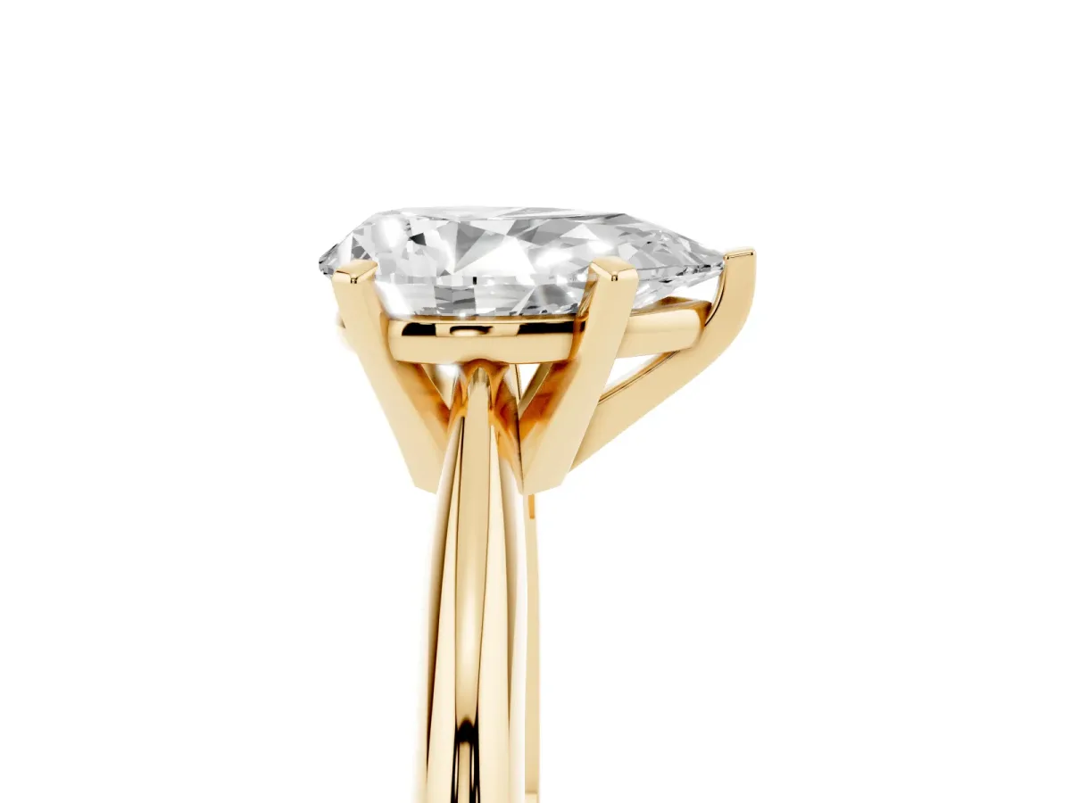 Pear Cut Cut Solitaire Ring with Four-Prong Setting on a Classic Band Yellow gold