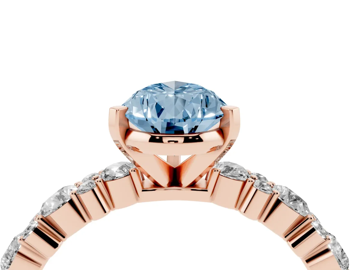 Fancy Blue Pear Cut Diamond Side Stone Solitaire Ring with Round and Four-Prong Setting Rose gold