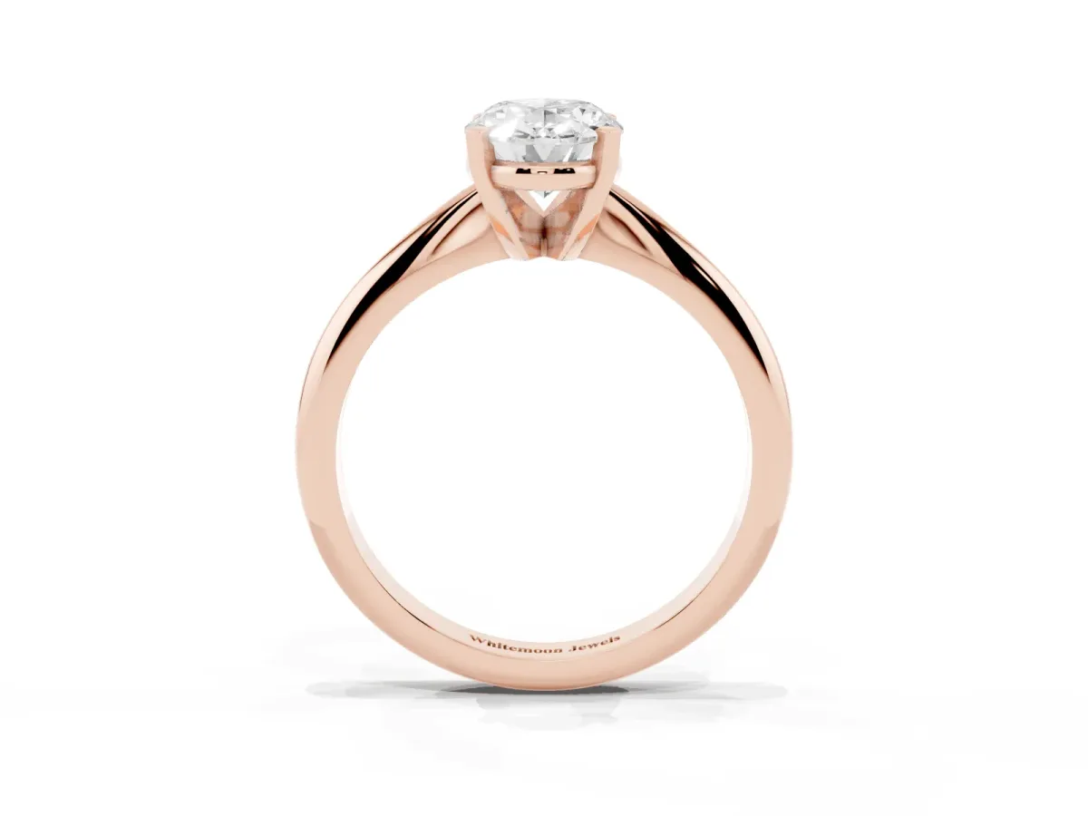 Oval Cut Cut Solitaire Ring with Four-Prong Setting on a Classic Band Rose gold