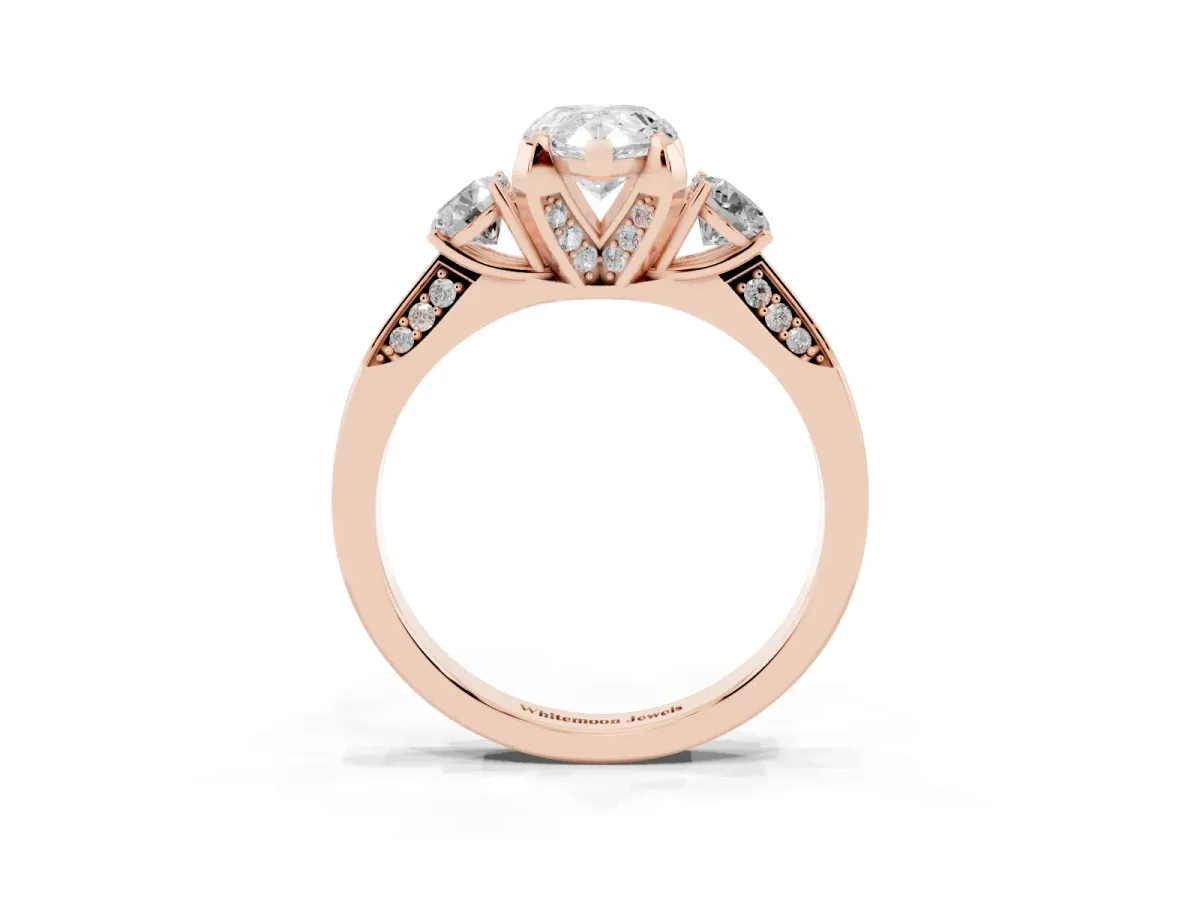 Pear Cut Brilliant Three-Stone Diamond Ring with Pavé Band and Four-Prong Setting Rose gold