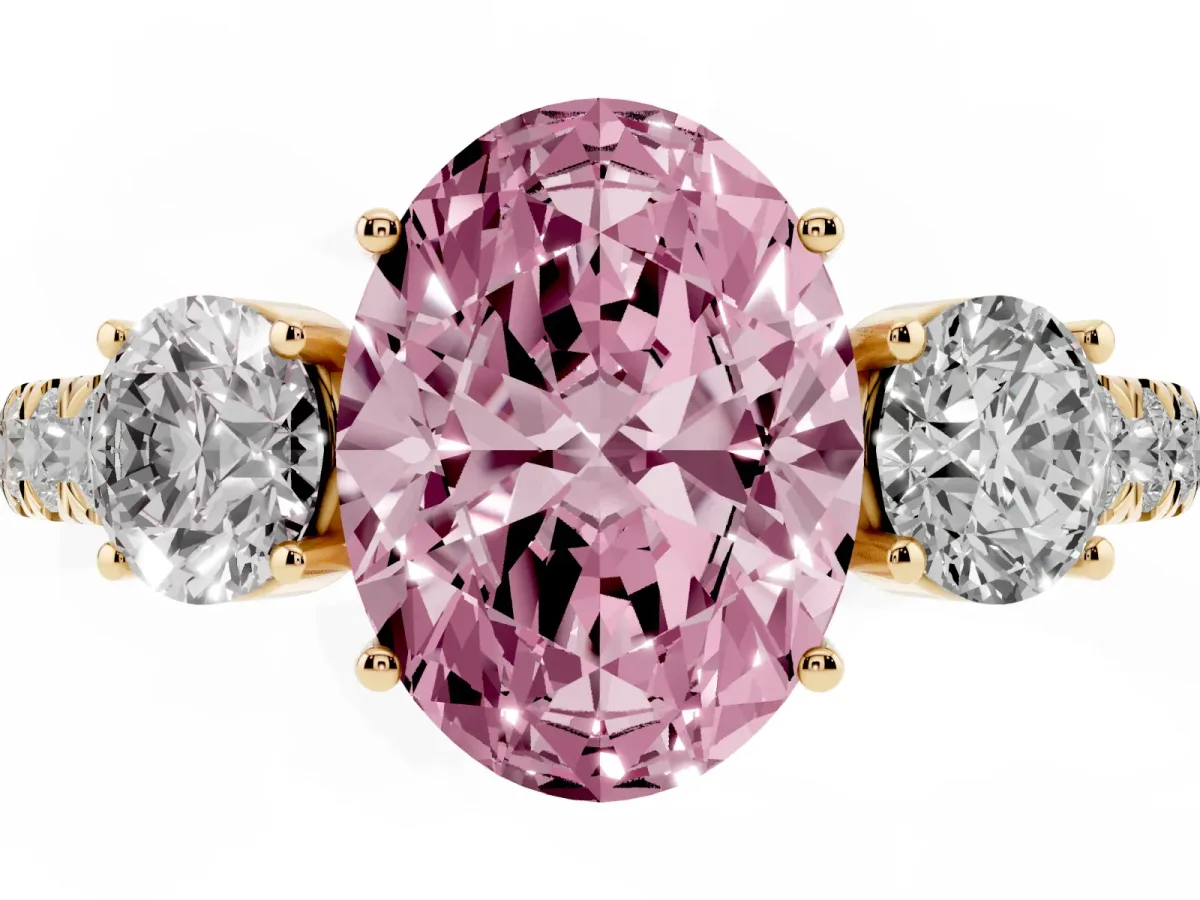 Fancy Pink Oval Cut Cut Diamond Three-Stone Ring with Round Side Stones and Pavé Band Yellow gold