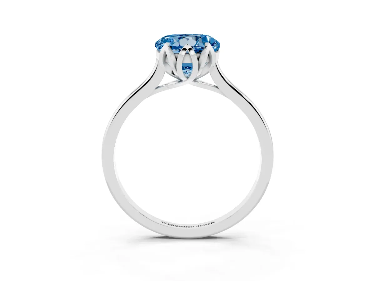 Fancy Blue Round Cut Diamond Solitaire Ring with Flower Prong Setting and Classic Band Silver