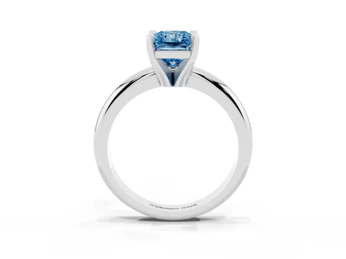 Fancy Blue Radiant Cut Diamond Solitaire Engagement Ring with Round Band and Four-Prong Setting Platinum