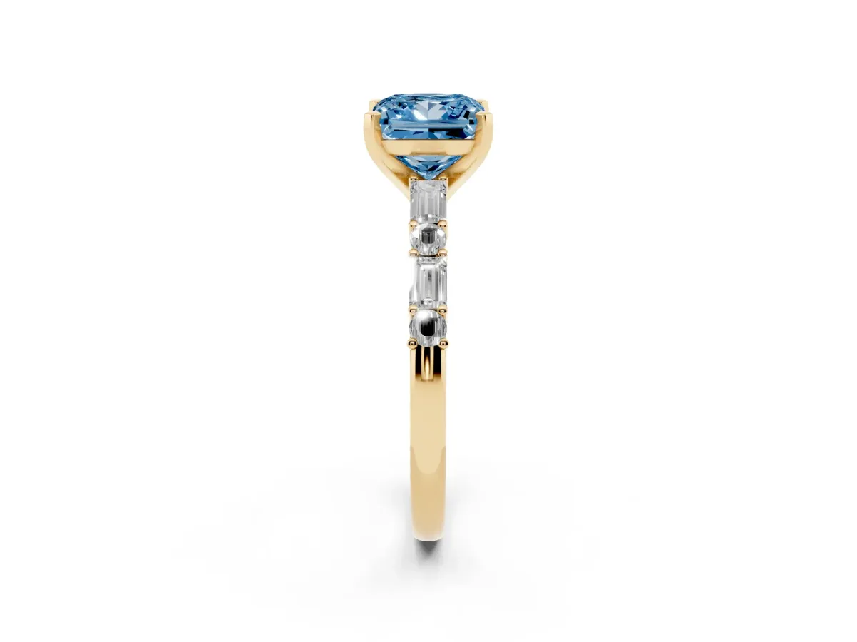 Fancy Blue Princess Cut Diamond Solitaire with Side Baguettes and Channel Set Band Yellow gold