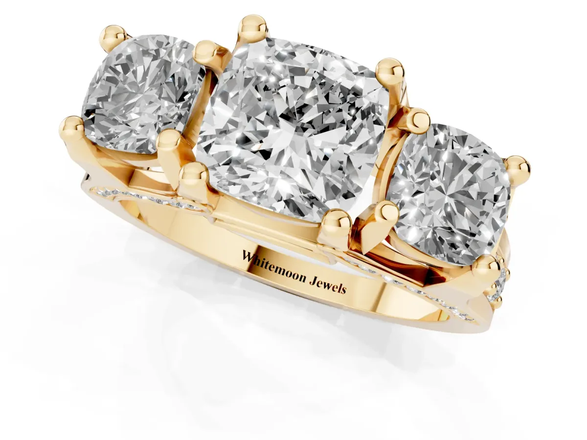 Cushion Cut Diamond Three-Stone Ring with Channel Set Band and Four-Prong Setting Yellow gold