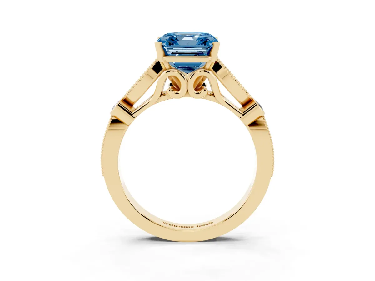 Fancy Blue Asscher Cut Cut Diamond with Milgrain Marquise and Bezel Accents on a Solitaire Band with Prong Setting Yellow gold
