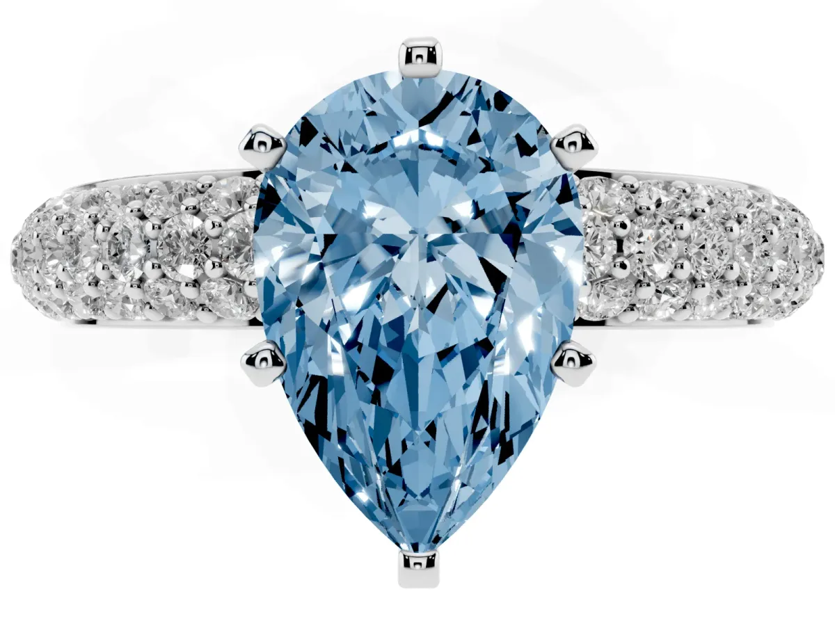 Fancy Blue Pear Cut Diamond Solitaire Ring with Prong Setting and Pavé Band Silver