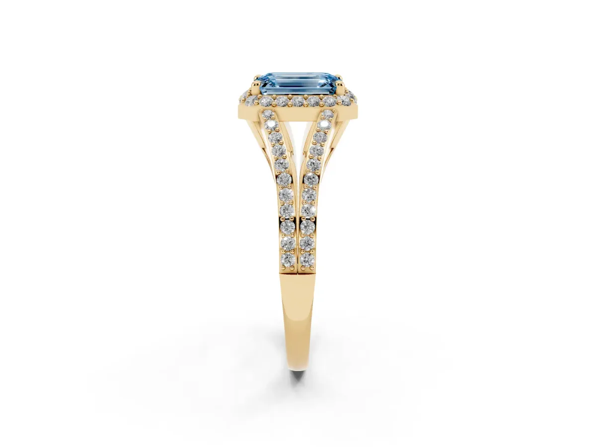 Fancy Blue Emerald Cut Halo Split Shank Diamond Ring with Prong Setting Yellow gold