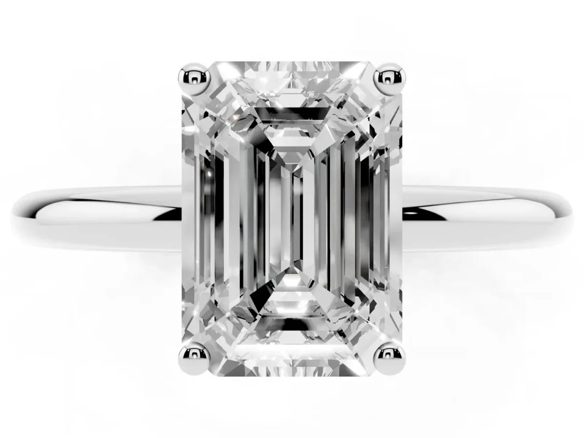 Emerald Cut Cut Solitaire Engagement Ring with Four-Prong Setting and Classic Band Silver