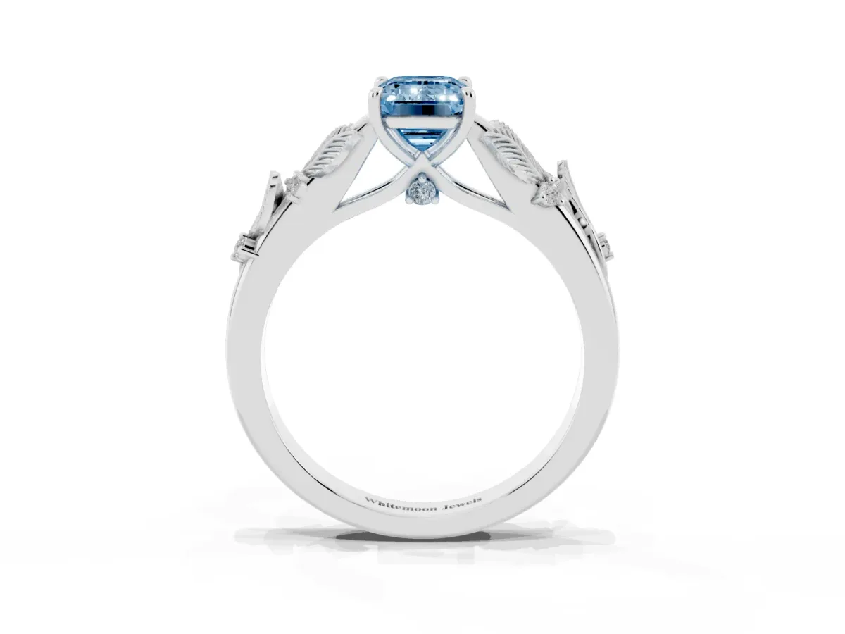Fancy Blue Emerald Cut Diamond Solitaire Ring with Leaf Motif Band and Four-Prong Setting Silver