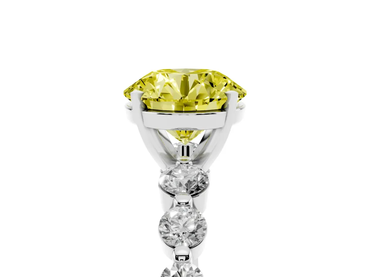 Fancy Yellow Round Cut Solitaire Diamond Ring with Pave Band and Four-Prong Setting Silver
