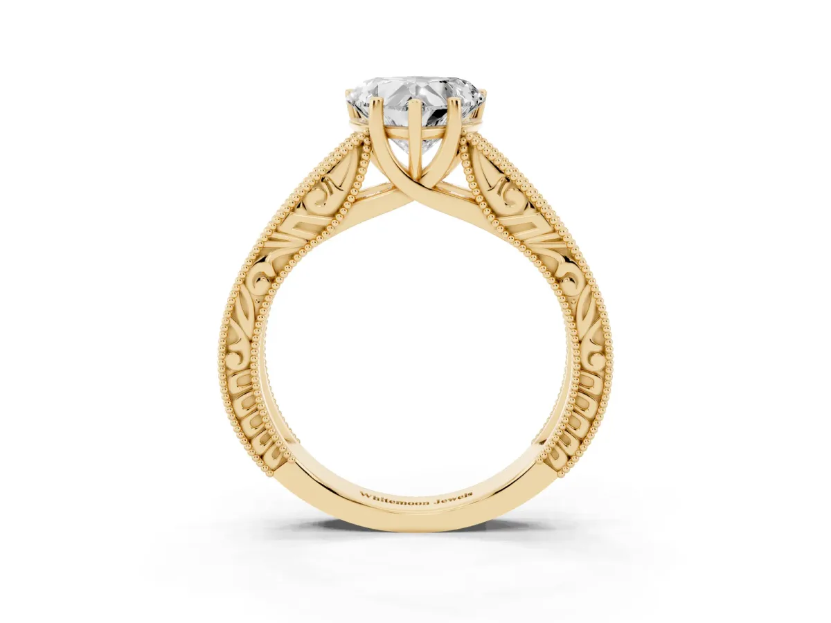 Heart Cut Diamond Solitaire Ring with Engraved Band and Four-Prong Setting Yellow gold