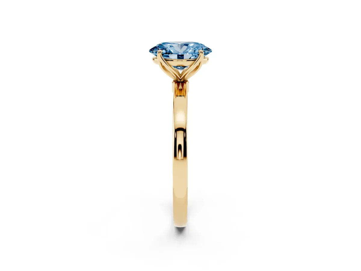 Fancy Blue Oval Cut Diamond Solitaire Ring with Thin Band and Prong Setting Yellow gold