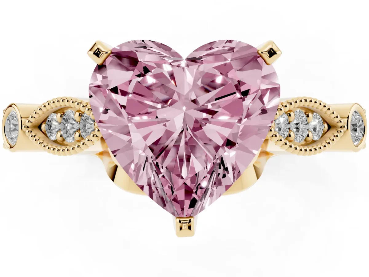 Fancy Pink Heart Cut Cut Diamond with Milgrain Marquise and Bezel Accents on a Solitaire Band with Prong Setting Yellow gold