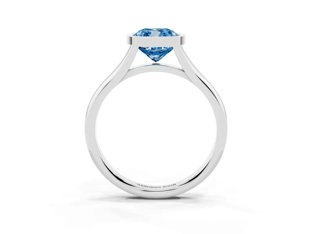 Fancy Blue Bezel Set Cushion Cut Cut Solitaire Ring with Tapered Band Silver