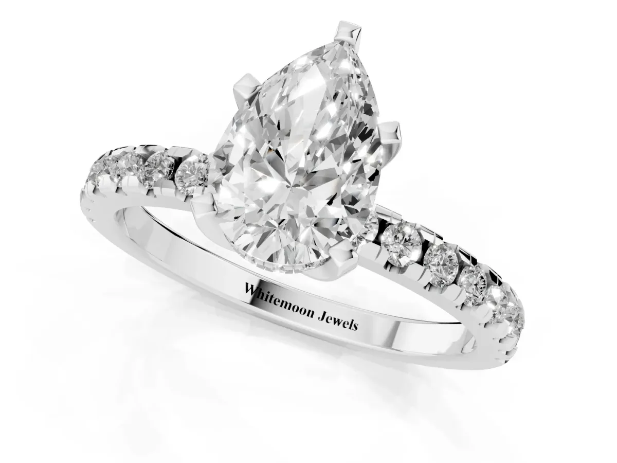 Pear Cut Diamond Solitaire Ring with Round Pavé Band and Four-Prong Setting Silver