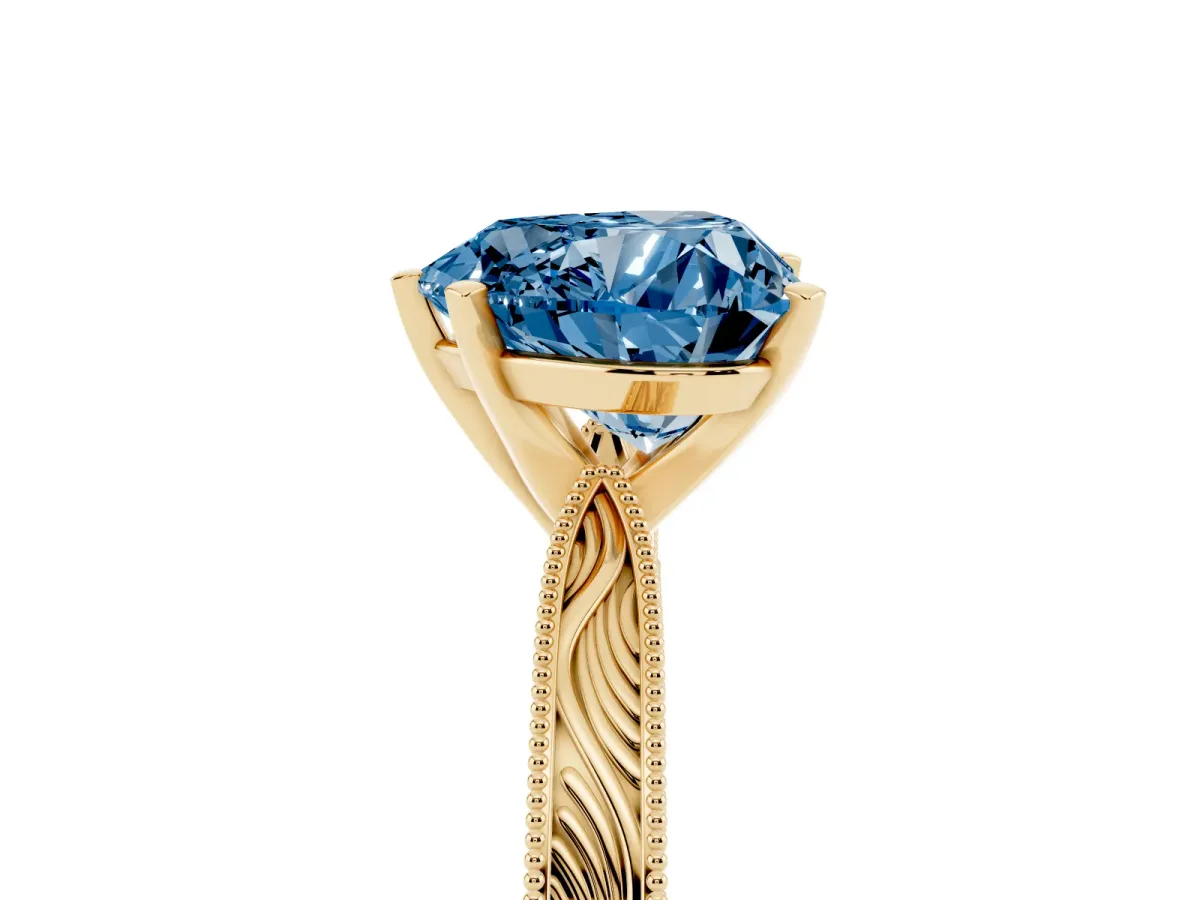 Fancy Blue Heart Cut Solitaire Milgrain Engraved Band with Four-Prong Setting Yellow gold