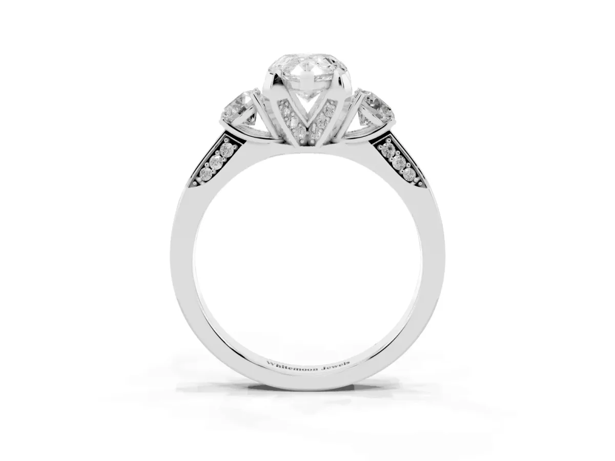 Pear Cut Brilliant Three-Stone Diamond Ring with Pavé Band and Four-Prong Setting Silver