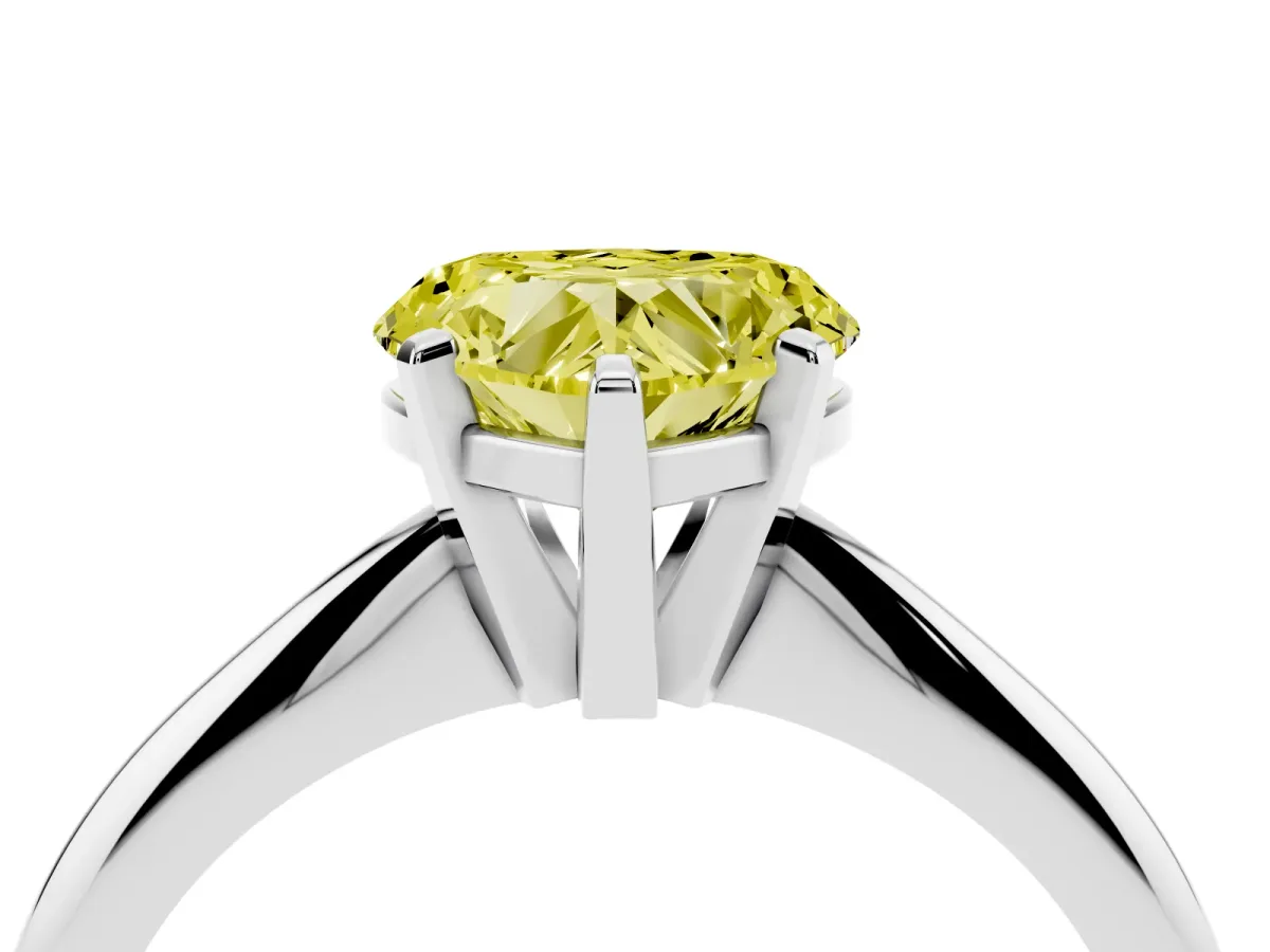 Fancy Yellow Heart Cut Cut Solitaire Ring with Four-Prong Setting on a Classic Band Silver