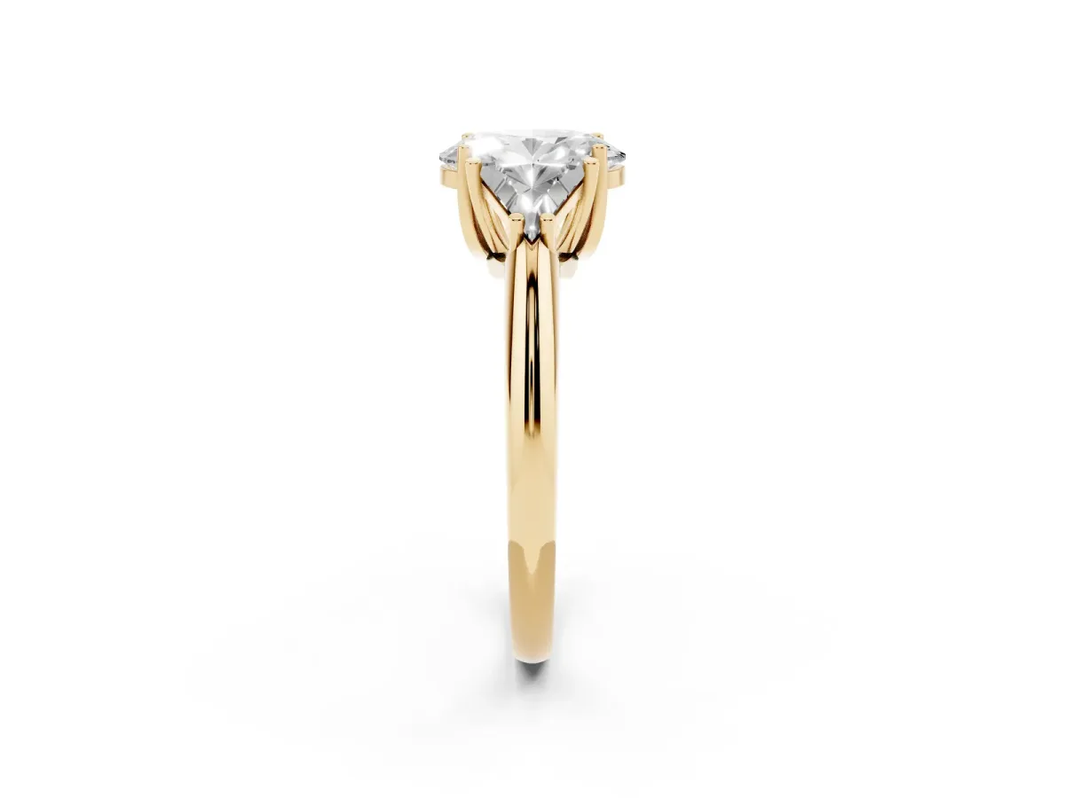 Three-Stone Oval Cut Diamond Engagement Ring with Trillion Side Stones and Prong Setting Yellow gold