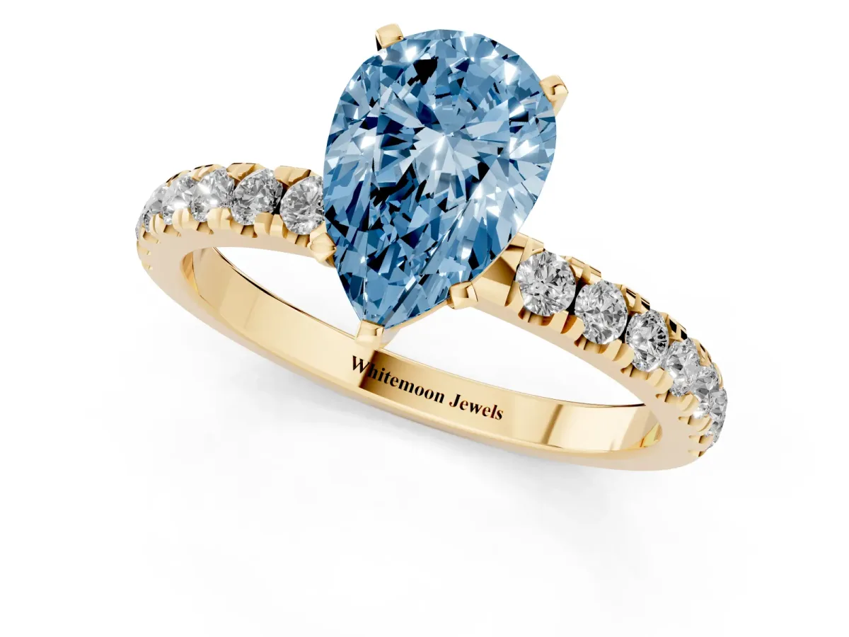 Fancy Blue Pear Cut Diamond Solitaire Ring with Pavé Accents and Four-Prong Setting Yellow gold