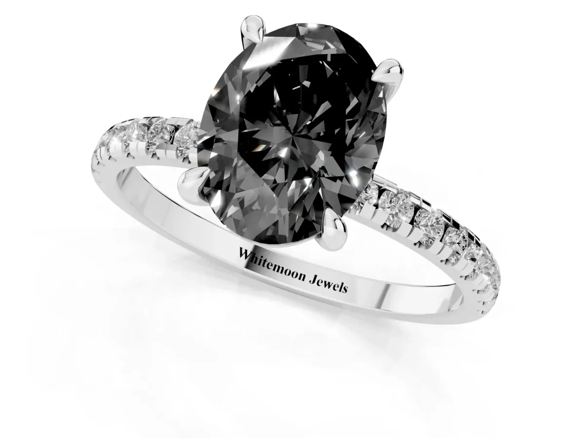 Fancy Black Oval Cut Diamond Brilliant Solitaire Ring with Pavé Band and Four-Prong Setting White gold