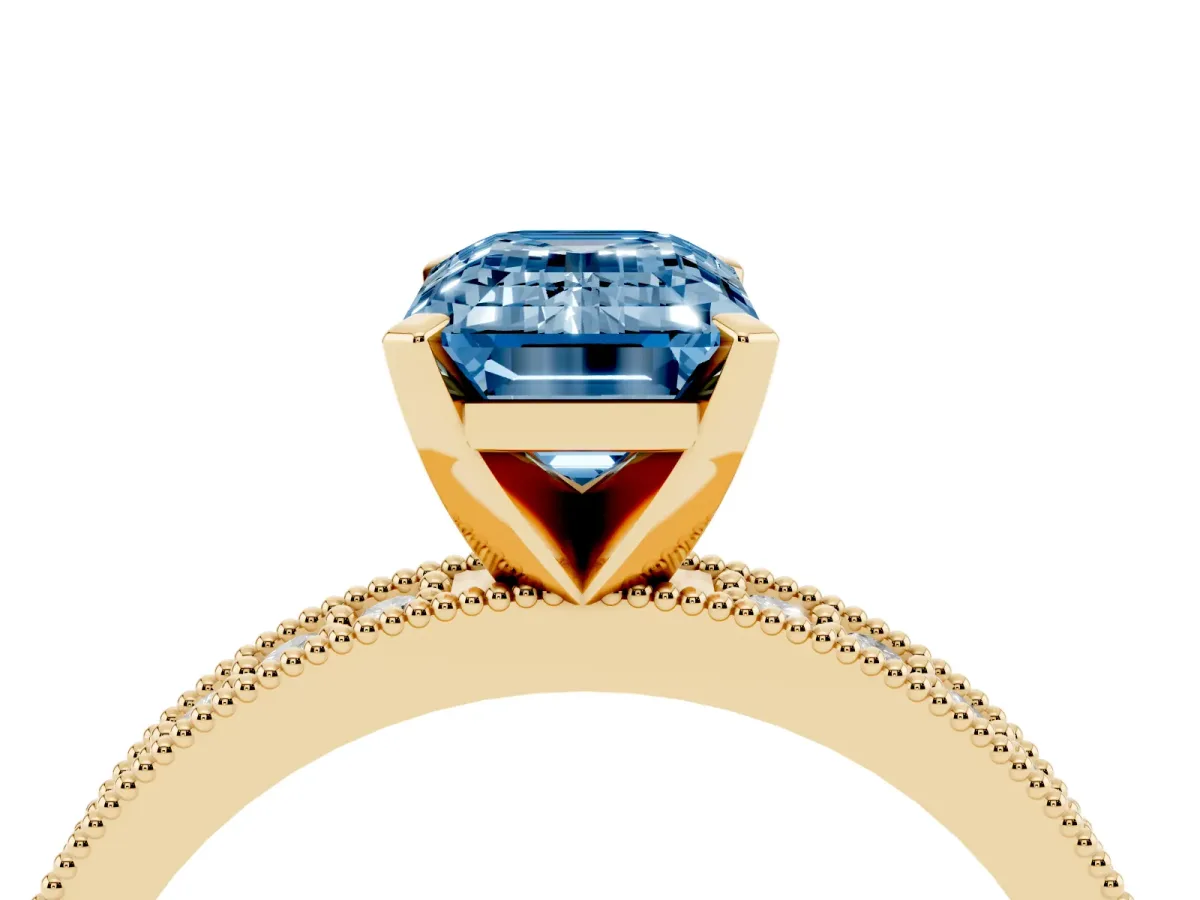 Fancy Blue Emerald Cut Diamond Milgrain Pavé Engagement Ring with Four-Prong Setting Yellow gold